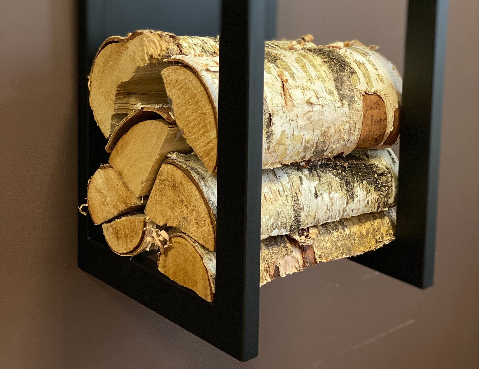 Plate wall mounted firewood rack